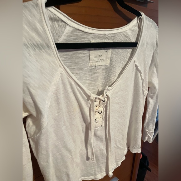 Brand: Free people Size: Small Style: White lace up top with quarter sleeves - Picture 1 of 4